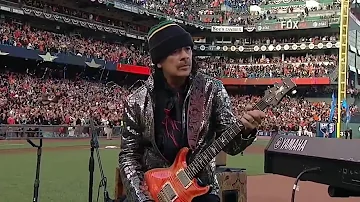 WS2014 Gm4: Carlos Santana and his son, Salvador, perform the national anthem