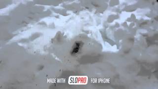 Fiery snow explosion land mine slow motion small scale