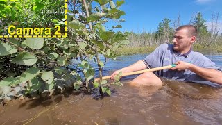 Unclogging A Culvert To Get The Water Off The Road