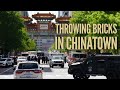 Biden lands at White House and crazy guy throws bricks off a building in Chinatown.