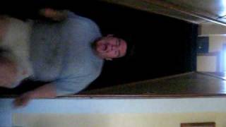 Fat man about to poop himself, sliding down stairs