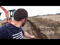 How to traverse an open trench with a mini-excavator.