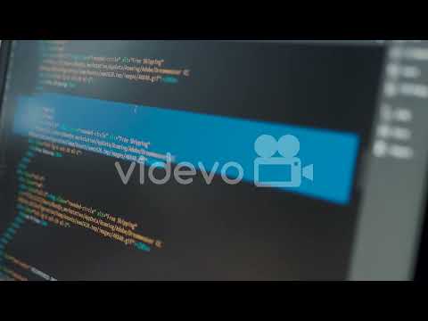 Developer is browsing html code on the computer screen