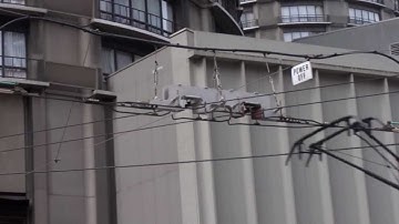 Seatle Streetcar crossing overhead wire of trolley bus