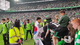 Celtic team celebrating league championship trophy day 2023