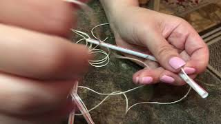 Making a robotic hand with straws and string.