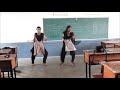 College girls dance in classroom