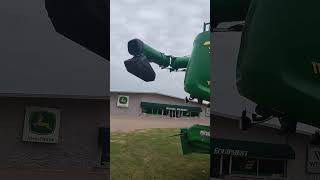 Two brand new John Deere X91100's with John Deere HD50R headers!