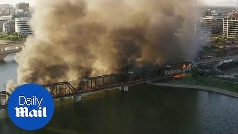 Massive train derailment and fire on Arizona bridge captured from the air