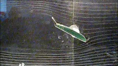 Airfoil with deflectable flaps in smoke tunnel showing streamlines