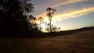 Time lapse video of a slow moving cloud formation over a beautiful wooded marsh.