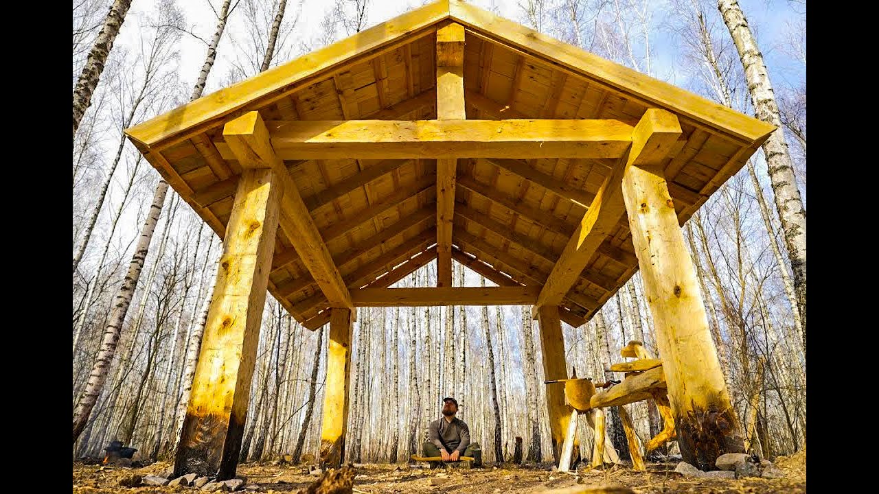 largest shed workshop built out of hew logs, using hand tools in the woods