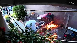 Guy uses red gas can to help ignite flame on portable BBQ then it tips over in backyard