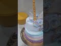 Unicorn 2 tier cake with special designs and pineapple flavored cake