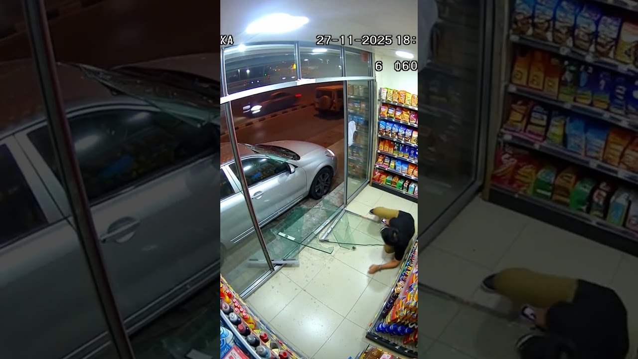 Car Crashes Through Storefront Window