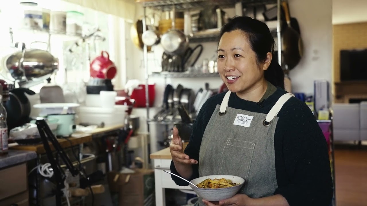 A chef presenting a dish at Stir Fry Stories