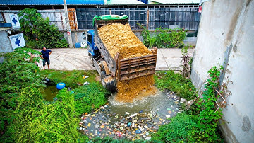 First Start a New Landfill Project! Using Dozer D20P Pushing Stone Soil with Dump Truck Unloading