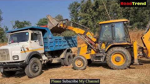 JCB Backhoe loading mud in tipper- Jcb backhoe machine cutting hill and loading soil in tipper