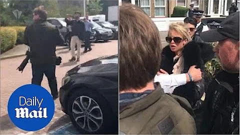 Mourners throw eggs during Henry Vincent's funeral...