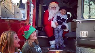 7th Precinct Community Service Officers Rivera and Wyckoff Assist Santa in Delivering Toys