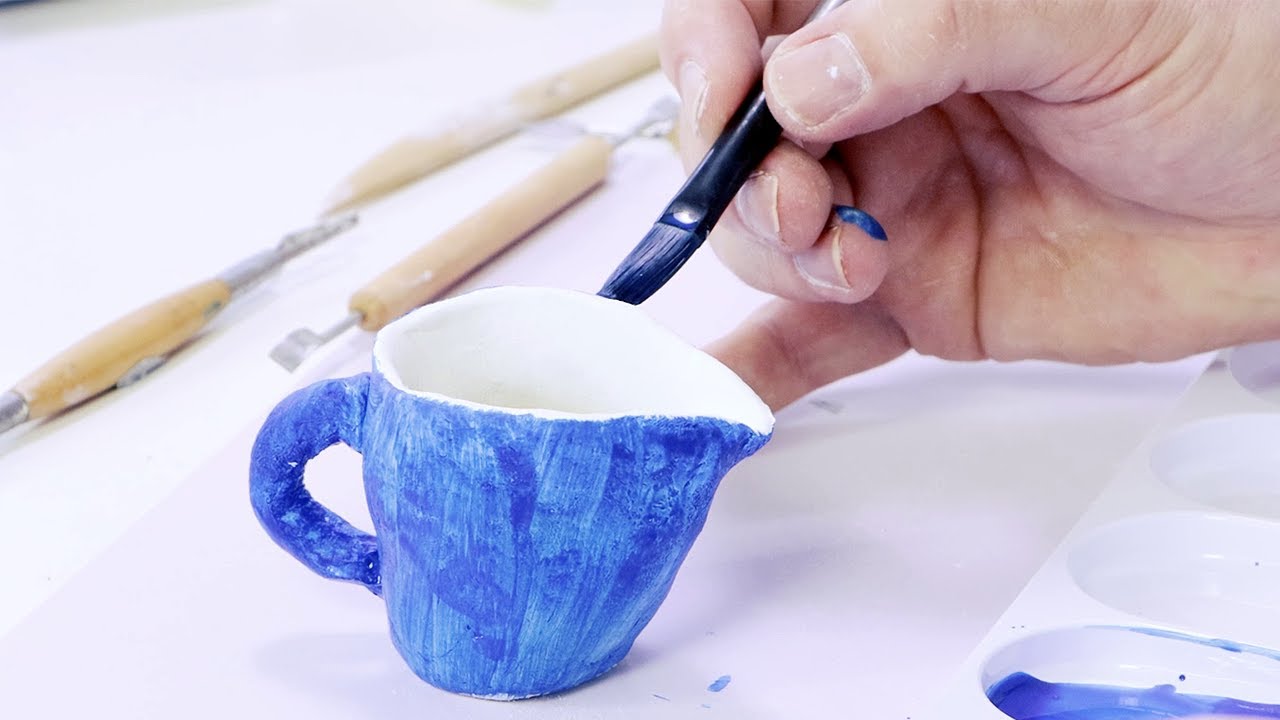 If I am baking a ceramic mug that was painted with acrylic paint that has  already dried for over 48 hours, do I need to place the cup upside down in  the