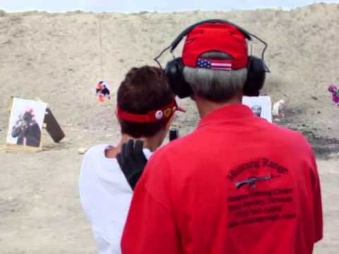 Some chick shoots a  full auto Glock 17 maybe 18?