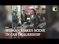 Woman makes scene in car dealership, gains online support