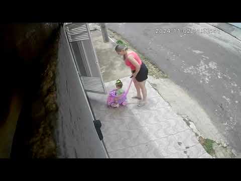 Baby Stroller Tips Over as Woman Tries to Pull It Through the Doorway