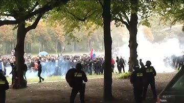 Anti-immigration protesters and police clash in the Netherlands