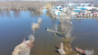 Petrie Island truck crossing flooded road .