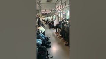 Japan train sitting people
