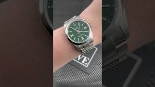 Rolex Oyster Perpetual 41mm Green Dial Steel Mens Watch 124300 Wrist Roll | SwissWatchExpo