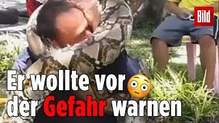 Feuerwehrmann wird von einer riesigen Python gewürgt