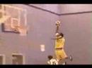 Damion Modeste jumps over defender's head for the dunk