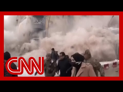 Dramatic video captures moment building collapses in Turkey.