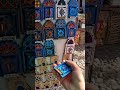 Travelwithchris buys a magnet in chefchaouen morocco  shorts morocco