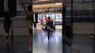 Woman Practices Ballet While Holding Her Baby in Baby Carrier