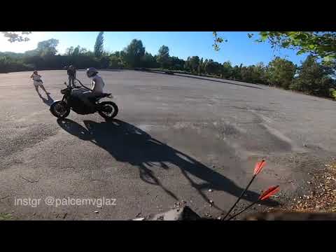 shooting bow from motorcycle