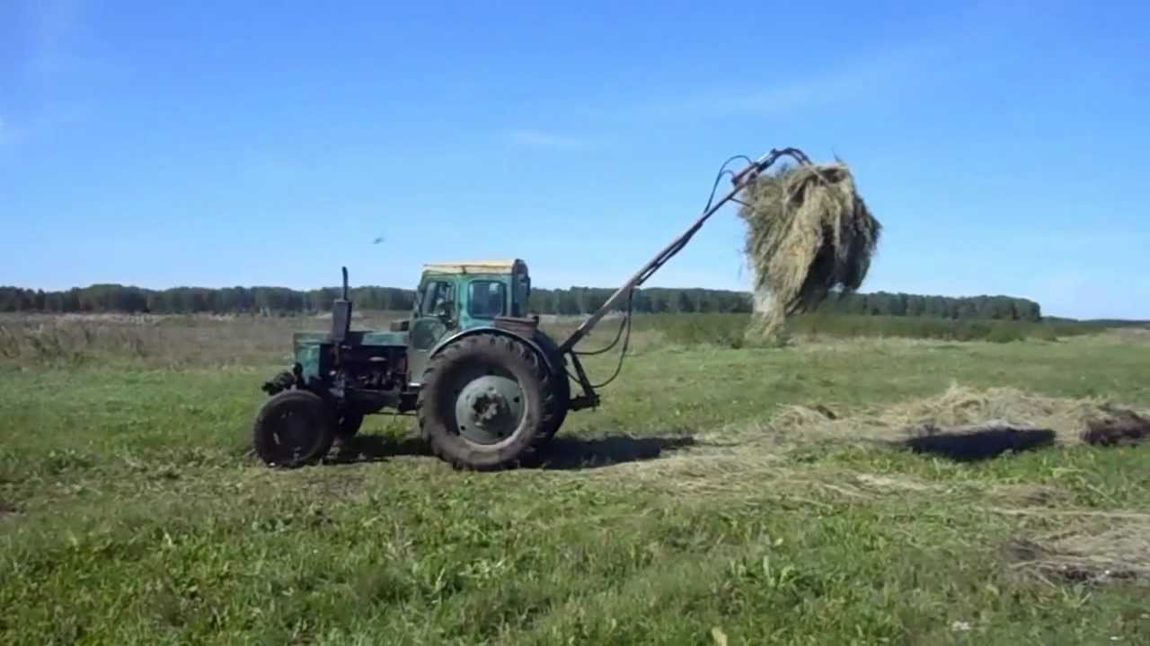 Трактора т 40 своими руками. Погрузчик тюков сена на т 25. Стогомет на т 40. Погрузчик на т 40. Погрузчик для рулонного сена для трактора т 25.