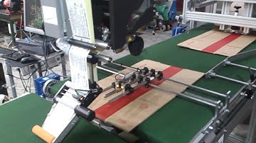 Automatic labelling of flat cardboard boxes with feeder unit.mp4