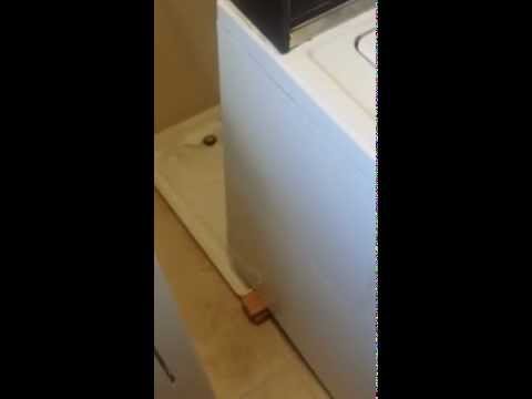 How To Move Laundry Machine Washer Up And Over Drain Pan Youtube