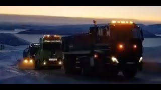 5 trucks needed for pulling up a wind turbine tower in the winter!