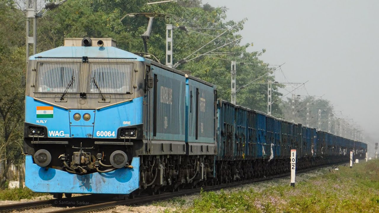 Saharanpur based WAG-12B (60064) powering a BOXN rake, departing New Jalpaiguri Junction 