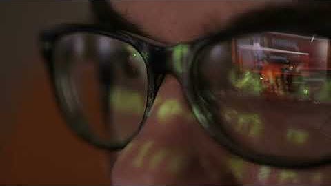 videoblocks code reflection in hackers glasses hacker coding in dark room H2S3l5rCox