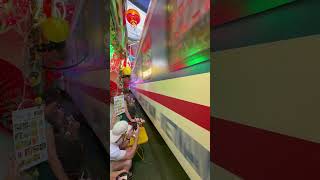 Train Passes Inches From Cafe Diners on Hanoi Street