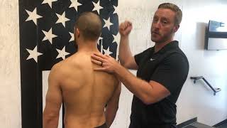 Palpation of the spine and boney landmarks