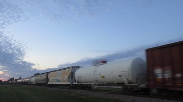 UP 4094 leads NS Dash 9 on EB mixed freight (CN M338)