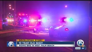 13-year-old critical after being shot while riding bike