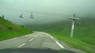 Driving the Col du Mont Cenis Pass through the clouds from Lanslebourg, France via Italy to Briancon