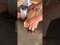 shaping curved edges on stacked wooden planks using a high speed wood shaper for a smooth finishing